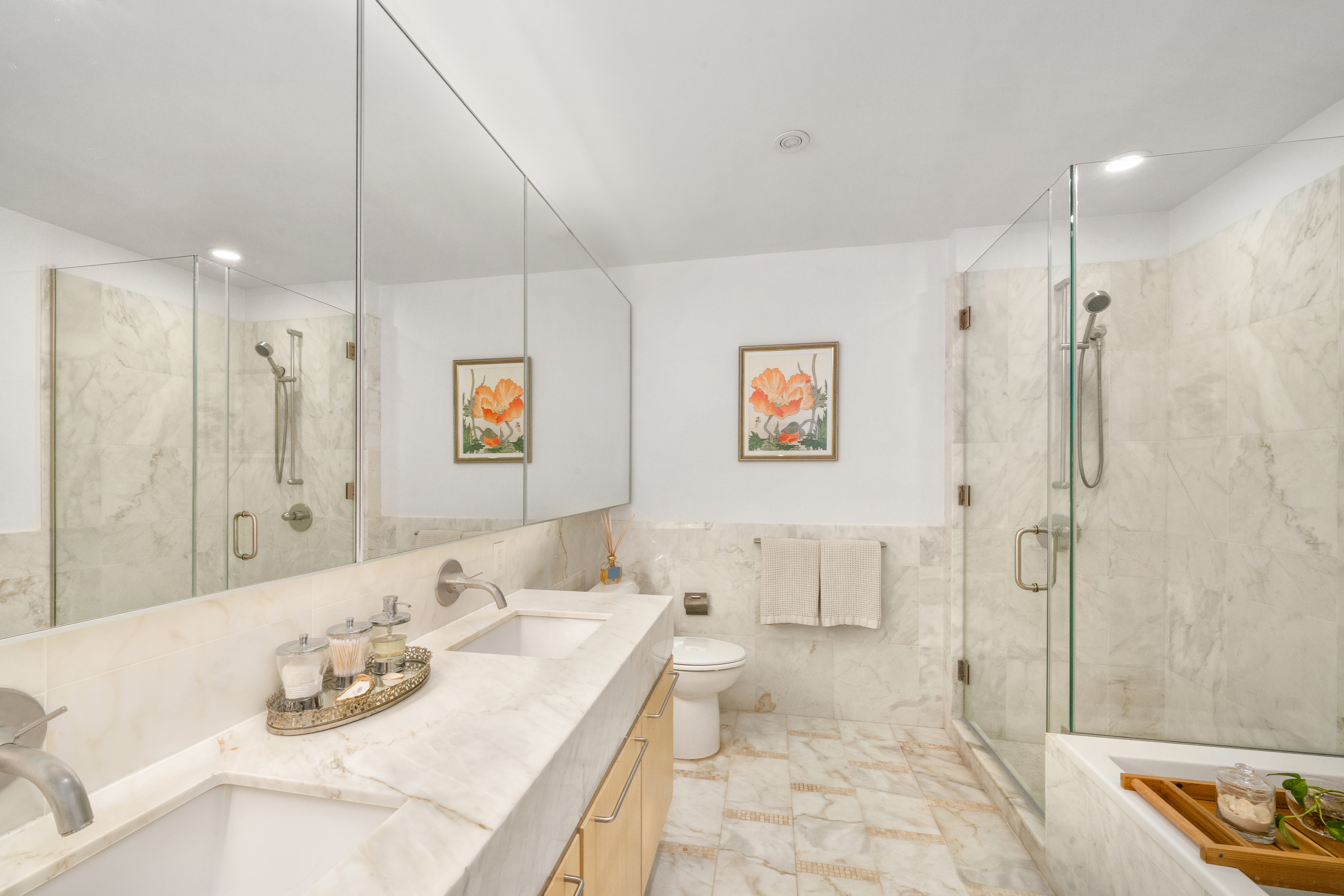 200 Chambers Street, Unit 25F Manhattan, NY 10007 - Photo 9 of 13 a bathroom with a tub sink and shower