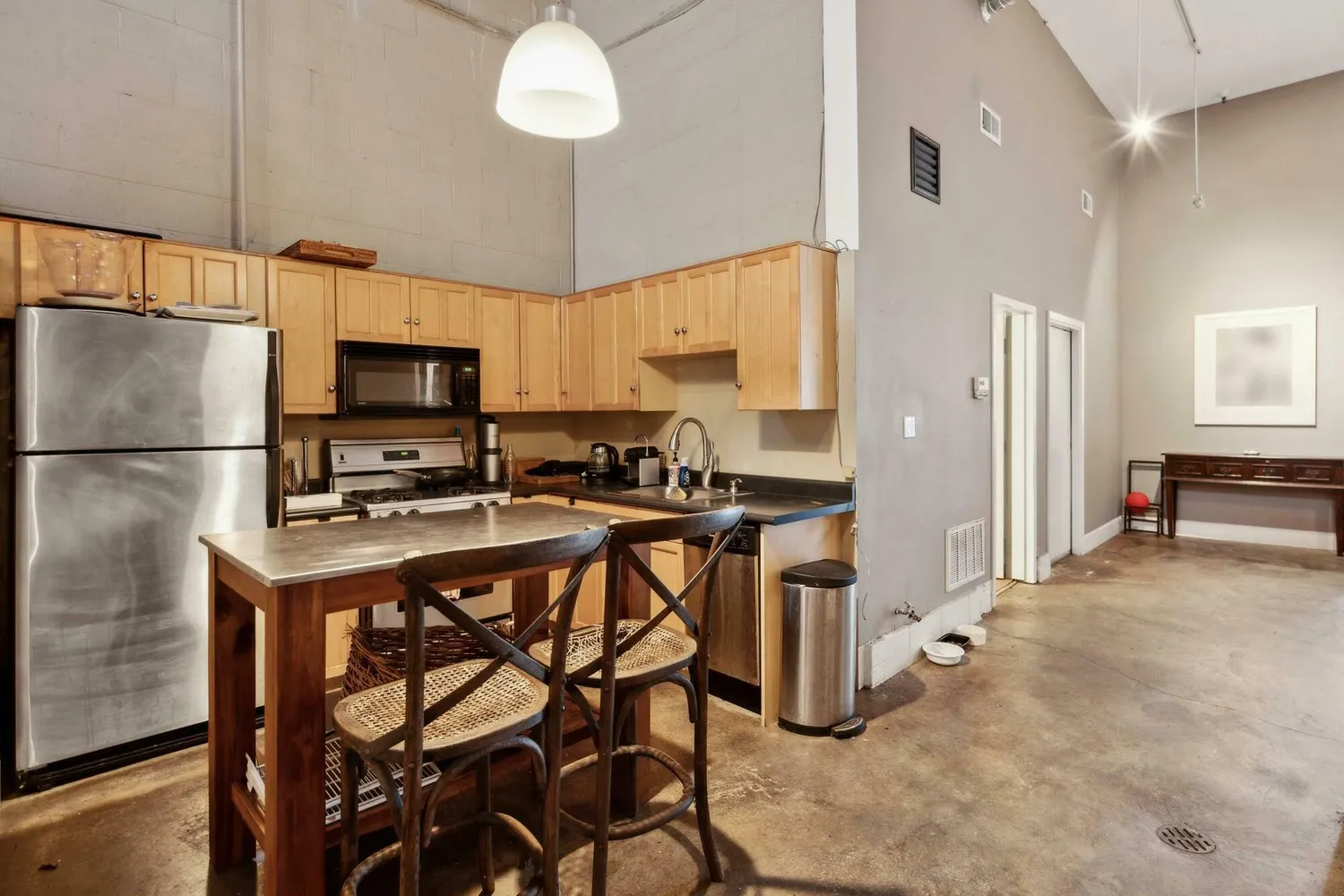 a living room with furniture a rug and a window