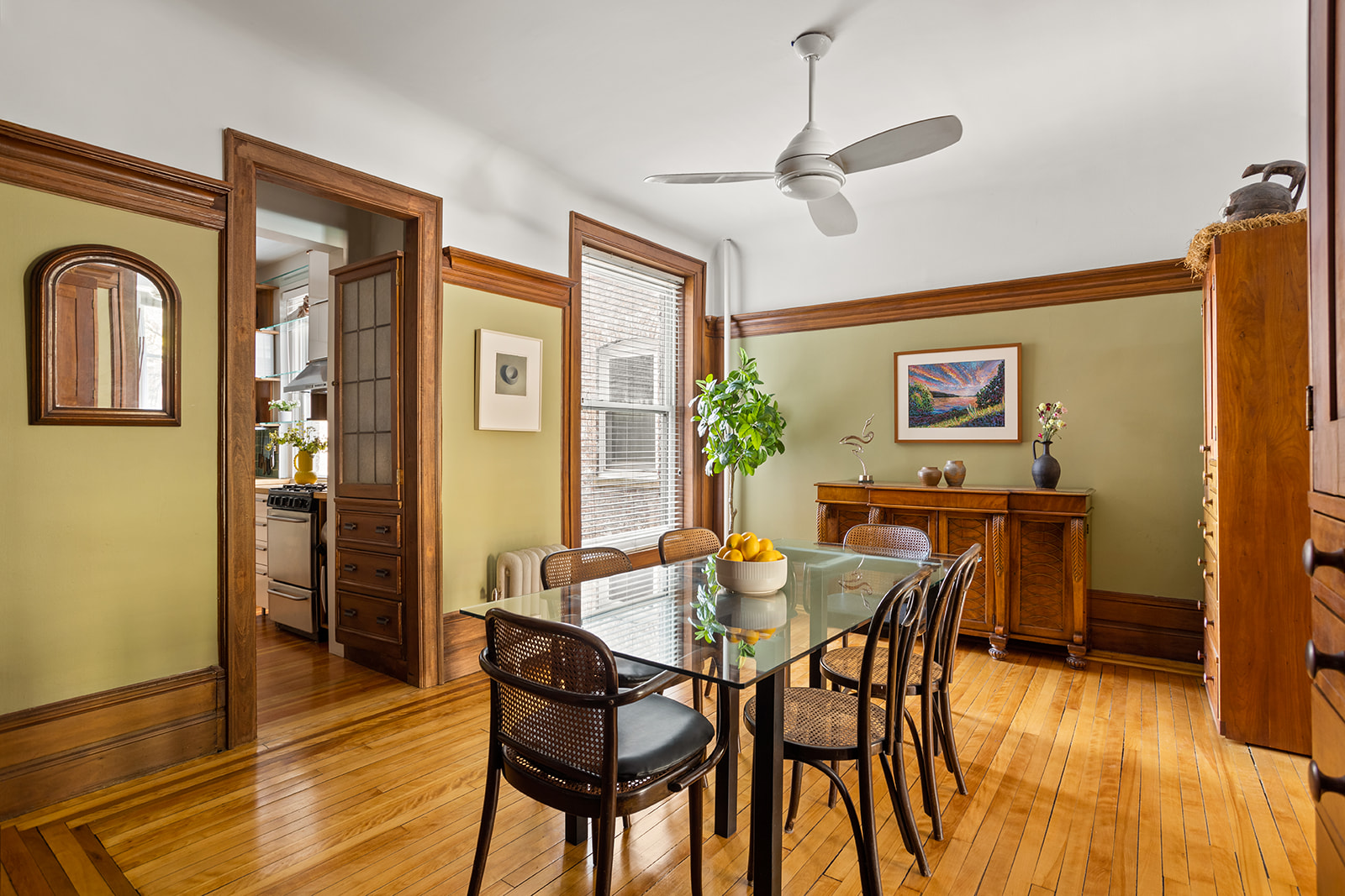 34-43 82nd Street, Unit 22 Queens, NY 11372 - Photo 2 of 11 a view of a dining room with furniture and wooden floor