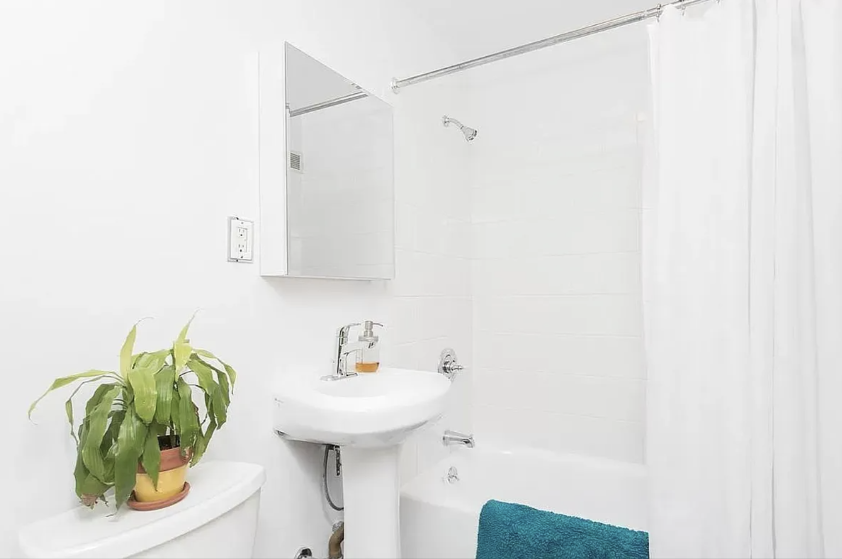488 Ocean Parkway, Unit 3G Brooklyn, NY 11218 - Photo 6 of 8 a bathroom with a sink and a mirror
