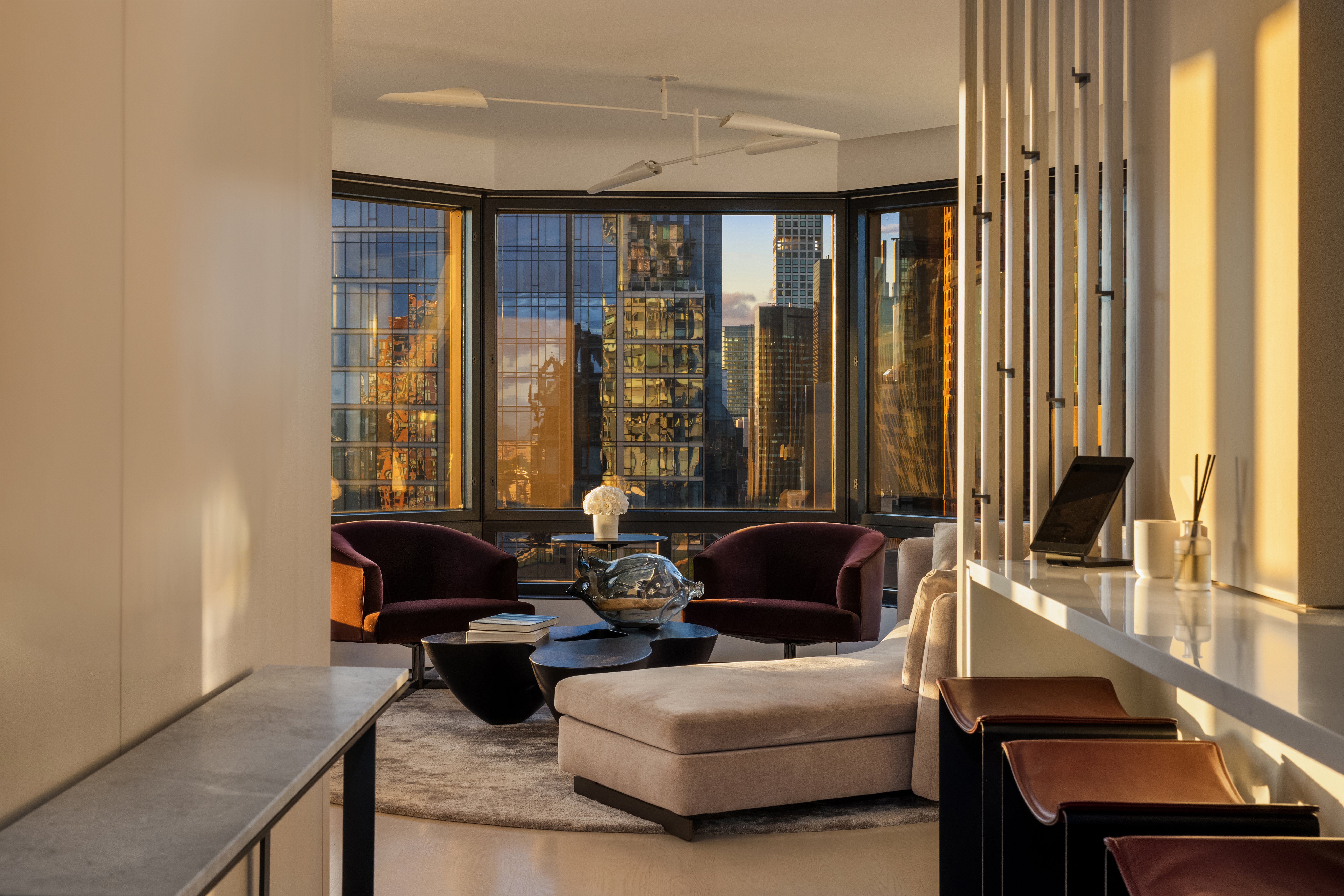 301 West 57th Street, Unit 36C Manhattan, NY 10019 - Photo 13 of 27 a living room with furniture and large windows