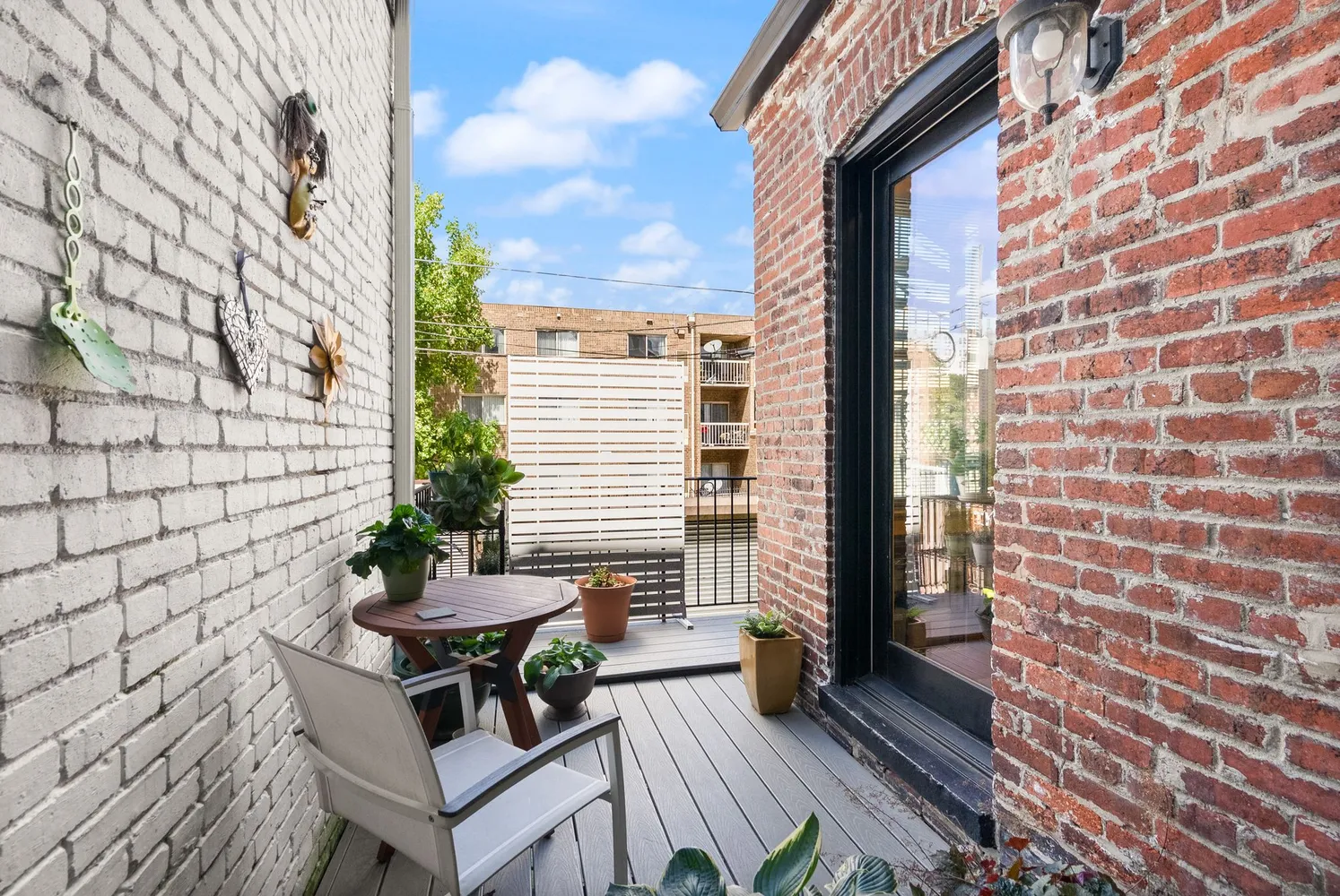 a bedroom with a bed mirror and window