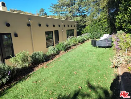 a bathroom with double sink and a mirror