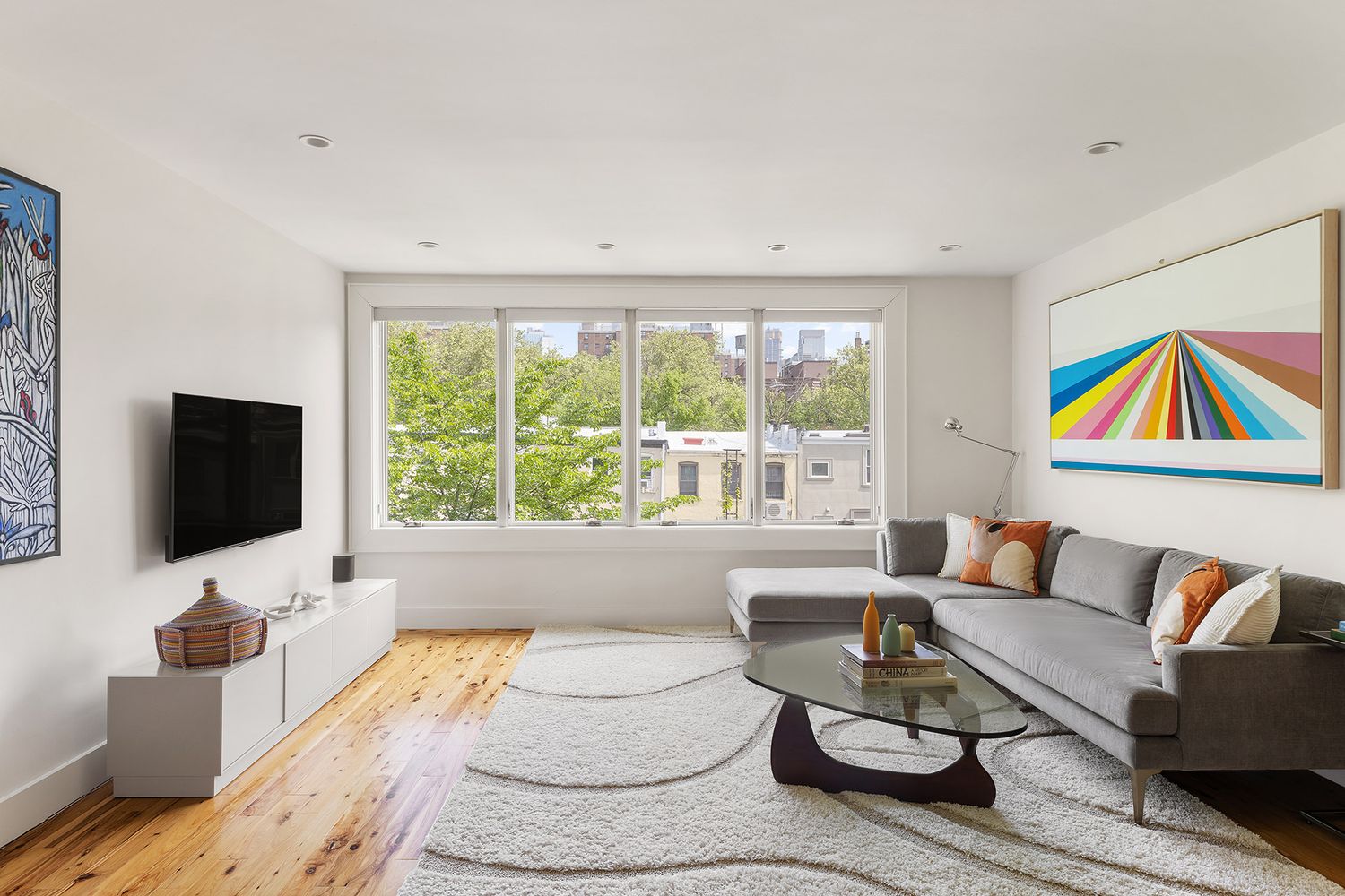 a living room with furniture and a flat screen tv