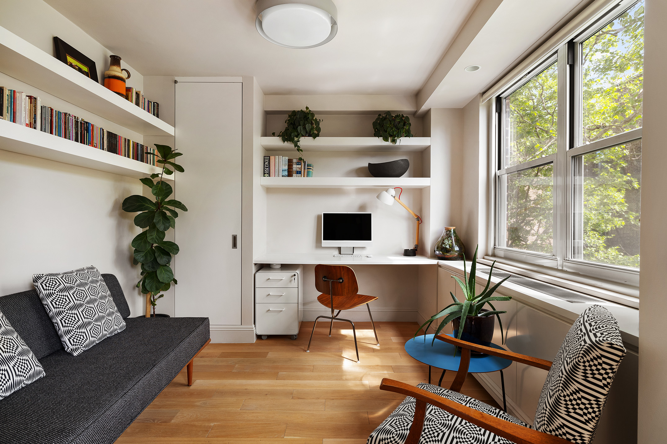 360 West 22nd Street, Unit 5M Manhattan, NY 10011 - Photo 6 of 16 a living room with furniture and a large window
