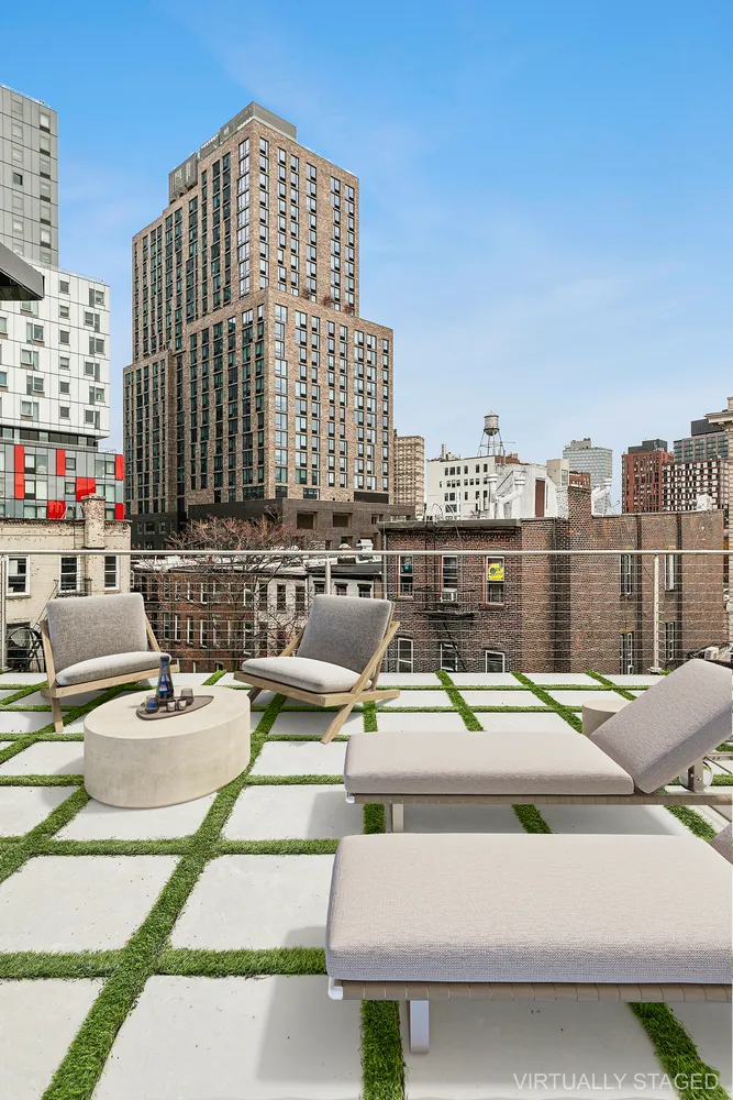 a view of balcony with couch and city view