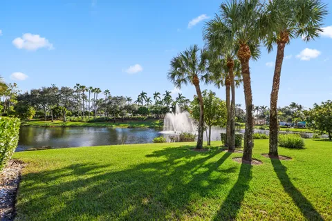 a view of a lake with houses in the back