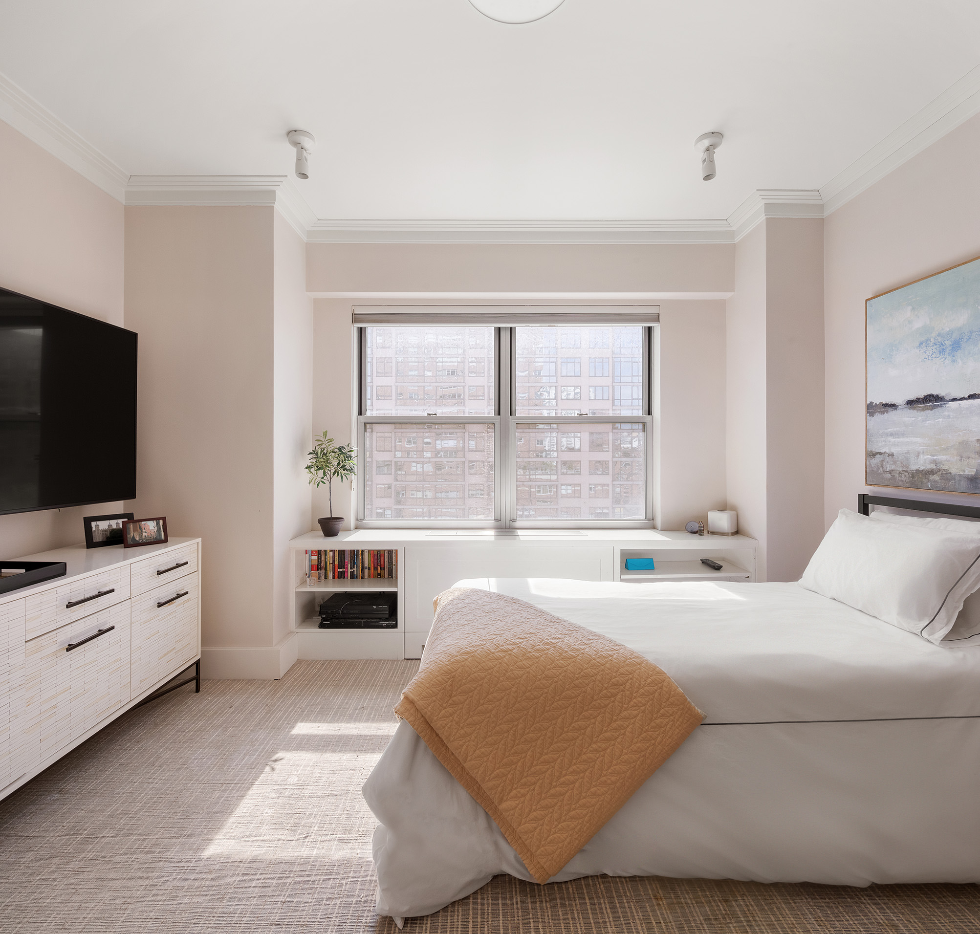 360 East 72nd Street, Unit C1801 Manhattan, NY 10021 - Photo 16 of 20 a bedroom with a bed and flat screen tv