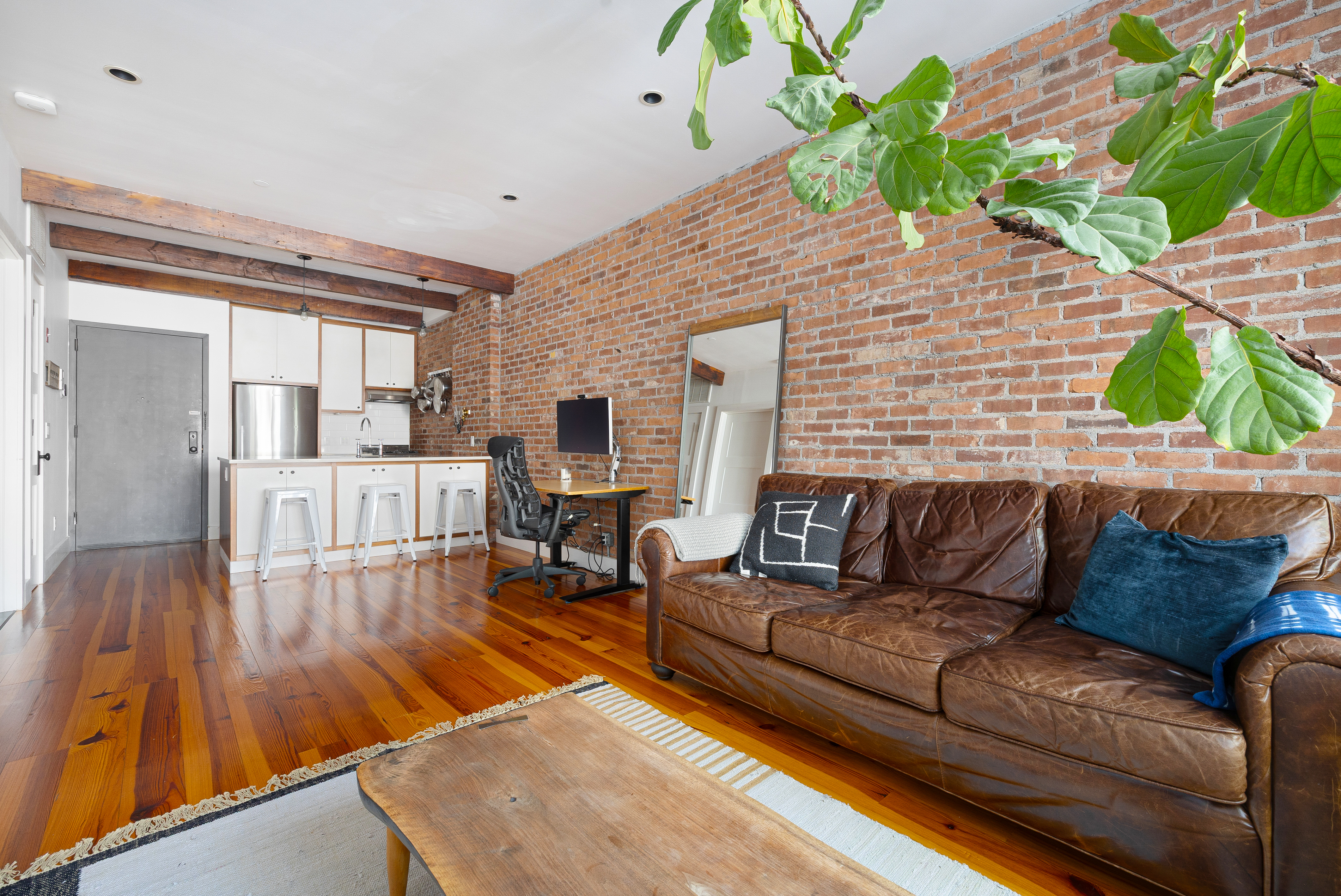 174 Jackson Street, Unit 2A Brooklyn, NY 11211 - Photo 7 of 17 a living room with furniture and a wooden floor