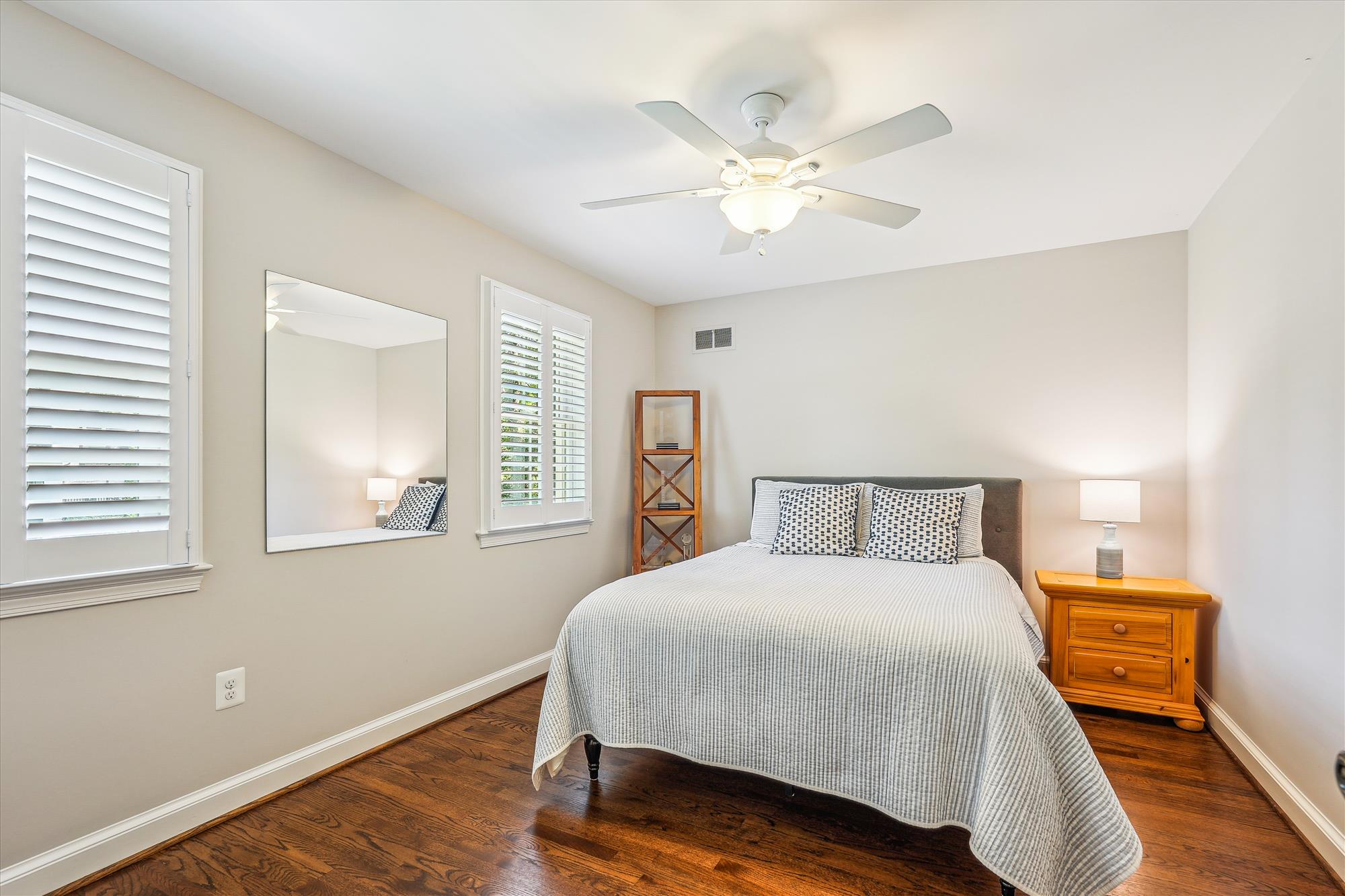 9904 Carter Road Bethesda, MD 20817 - Photo 28 of 41 a bedroom with a bed and a chandelier