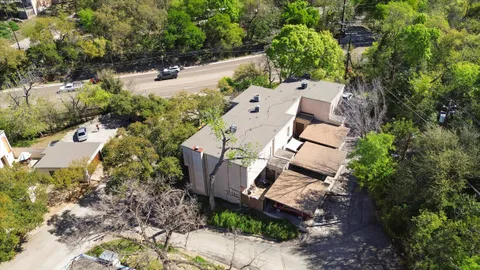 an aerial view of multiple houses with yard