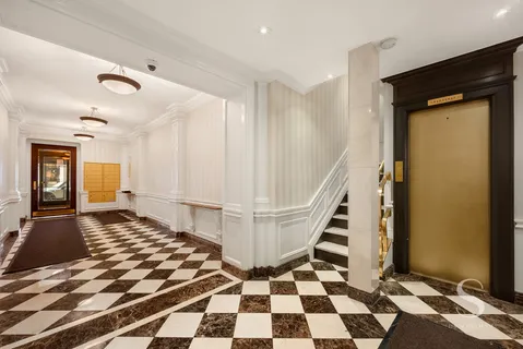 a view of a bathroom with a black and white checkered floor