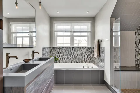 a bathroom with a bathtub and a sink
