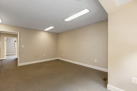 an empty room with a empty space and window