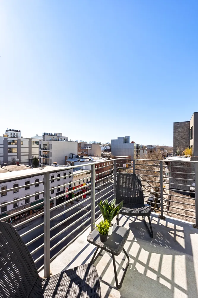 a view of a balcony with city view