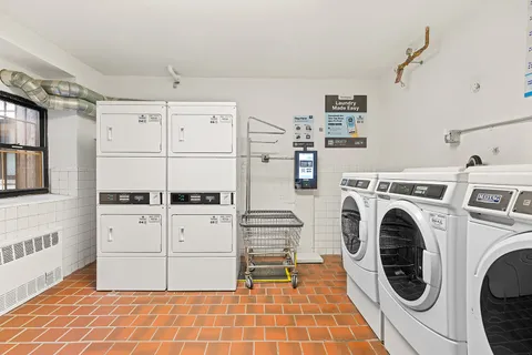 a view of a hallway with washer and dryer