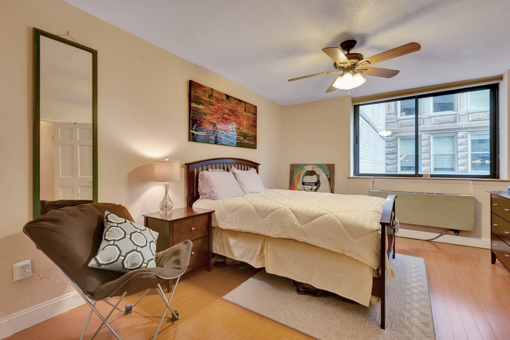 280 Park Avenue South, Unit 4D Manhattan, NY 10010 - Photo 3 of 13 a bedroom with a bed and wooden floor