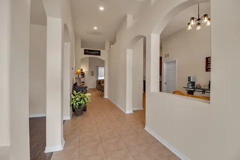 a view of a dining room with furniture and a large window