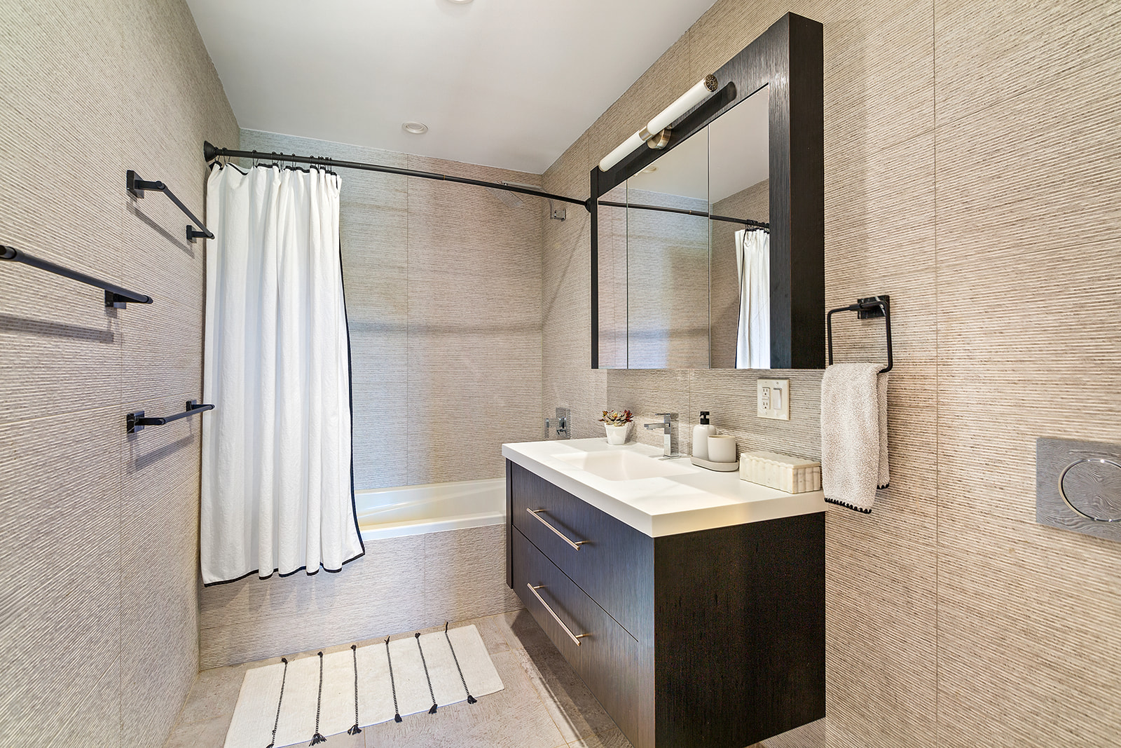 695 6th Avenue, Unit 2L Brooklyn, NY 11215 - Photo 6 of 10 a bathroom with a sink a mirror and a shower