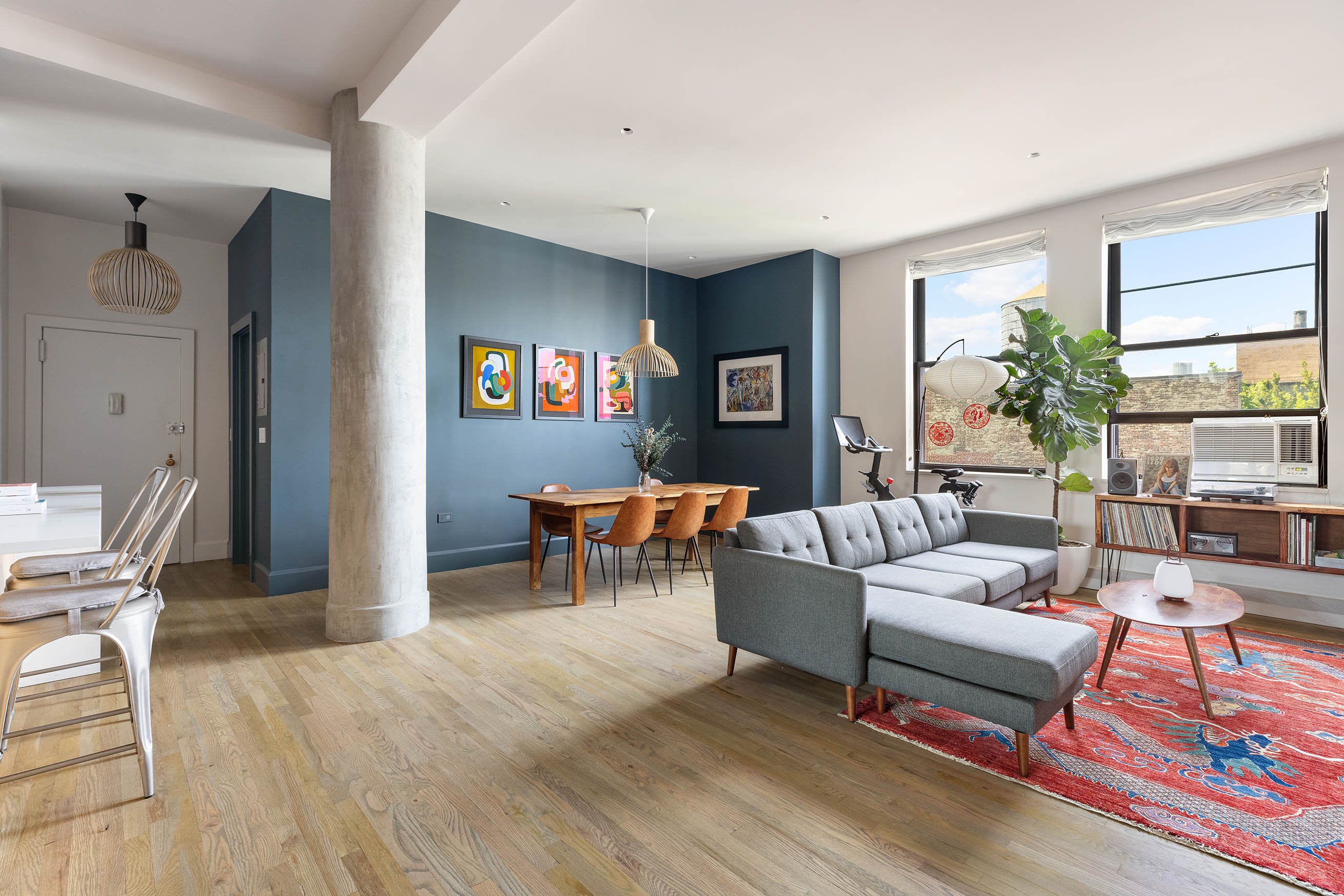 250 Mercer Street, Unit B1401 Manhattan, NY 10012 - Photo 2 of 8 a living room with furniture and a window