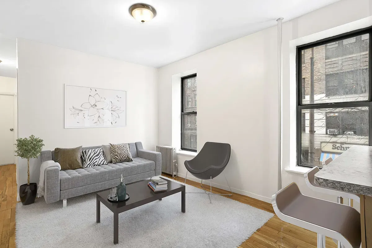 a living room with furniture and a window