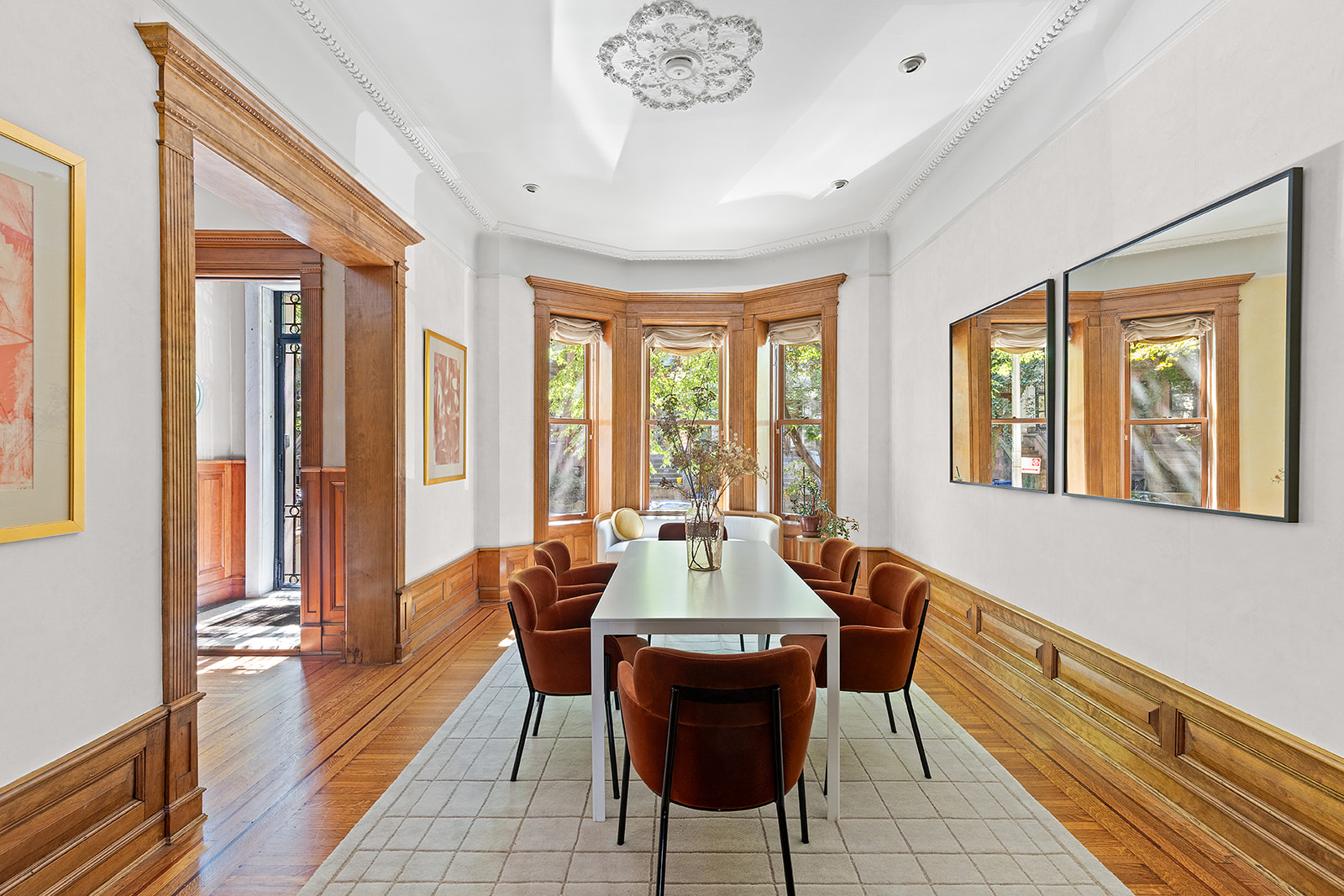 623 2nd Street Brooklyn, NY 11215 - Photo 7 of 26 a dining room with furniture a chandelier and wooden floor