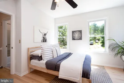 a bedroom with a bed and a couch