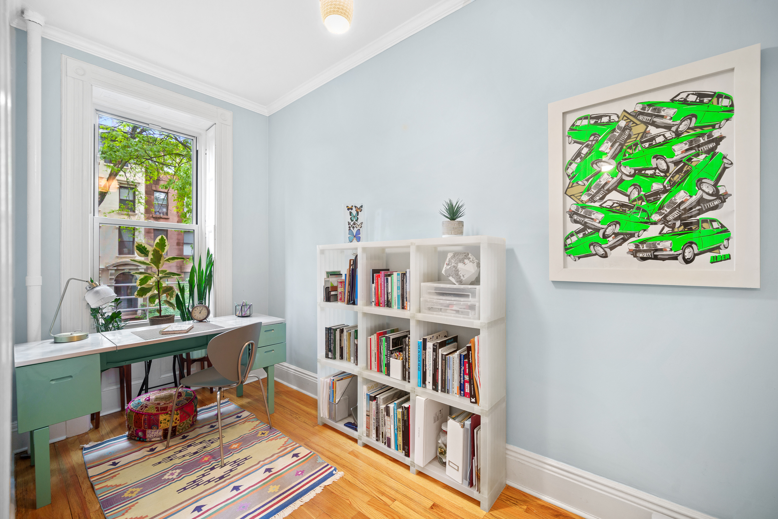 182 Saint Marks Avenue, Unit 2 Brooklyn, NY 11238 - Photo 10 of 14 a room with furniture and a book shelf