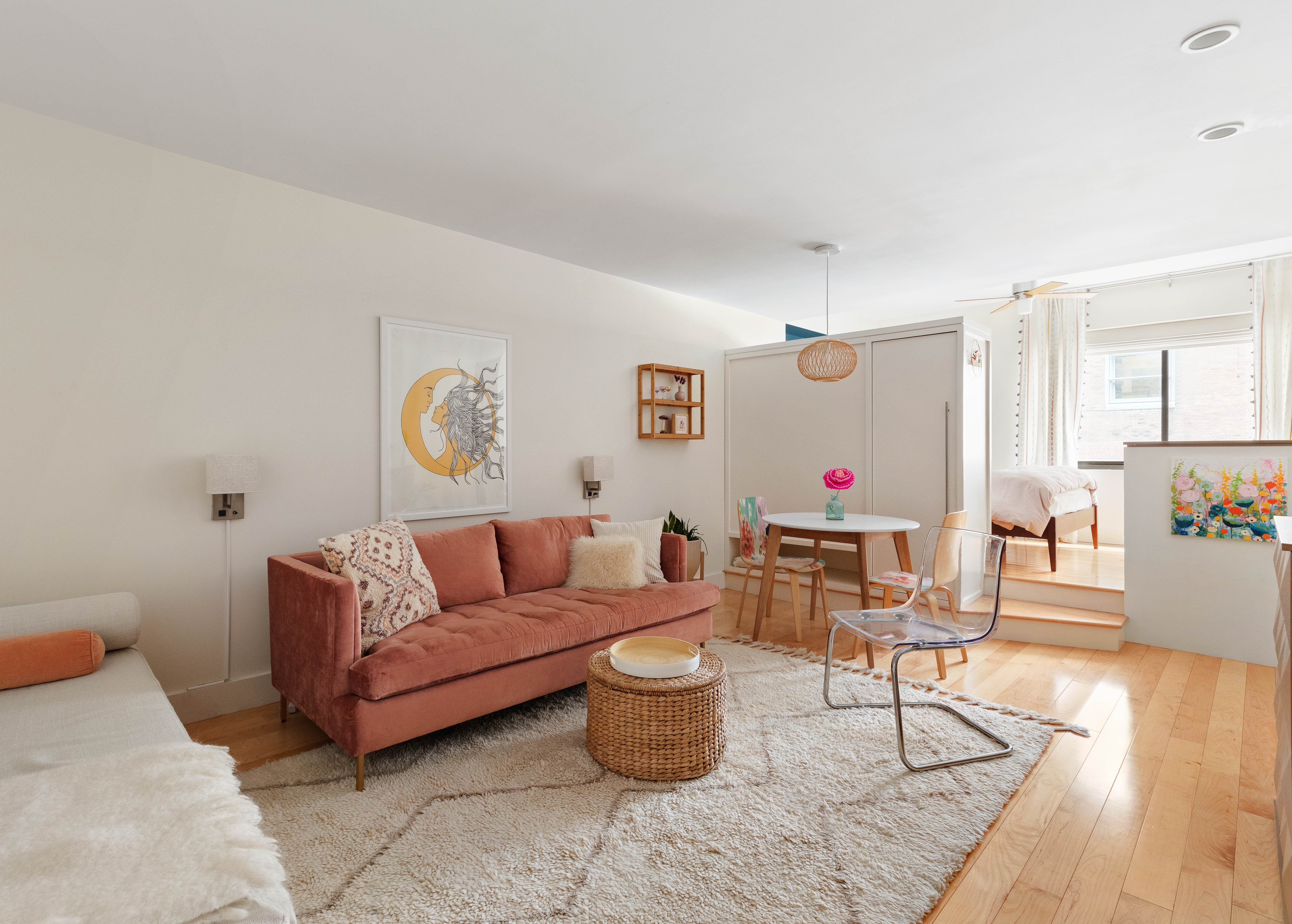 a living room with furniture and a wooden floor