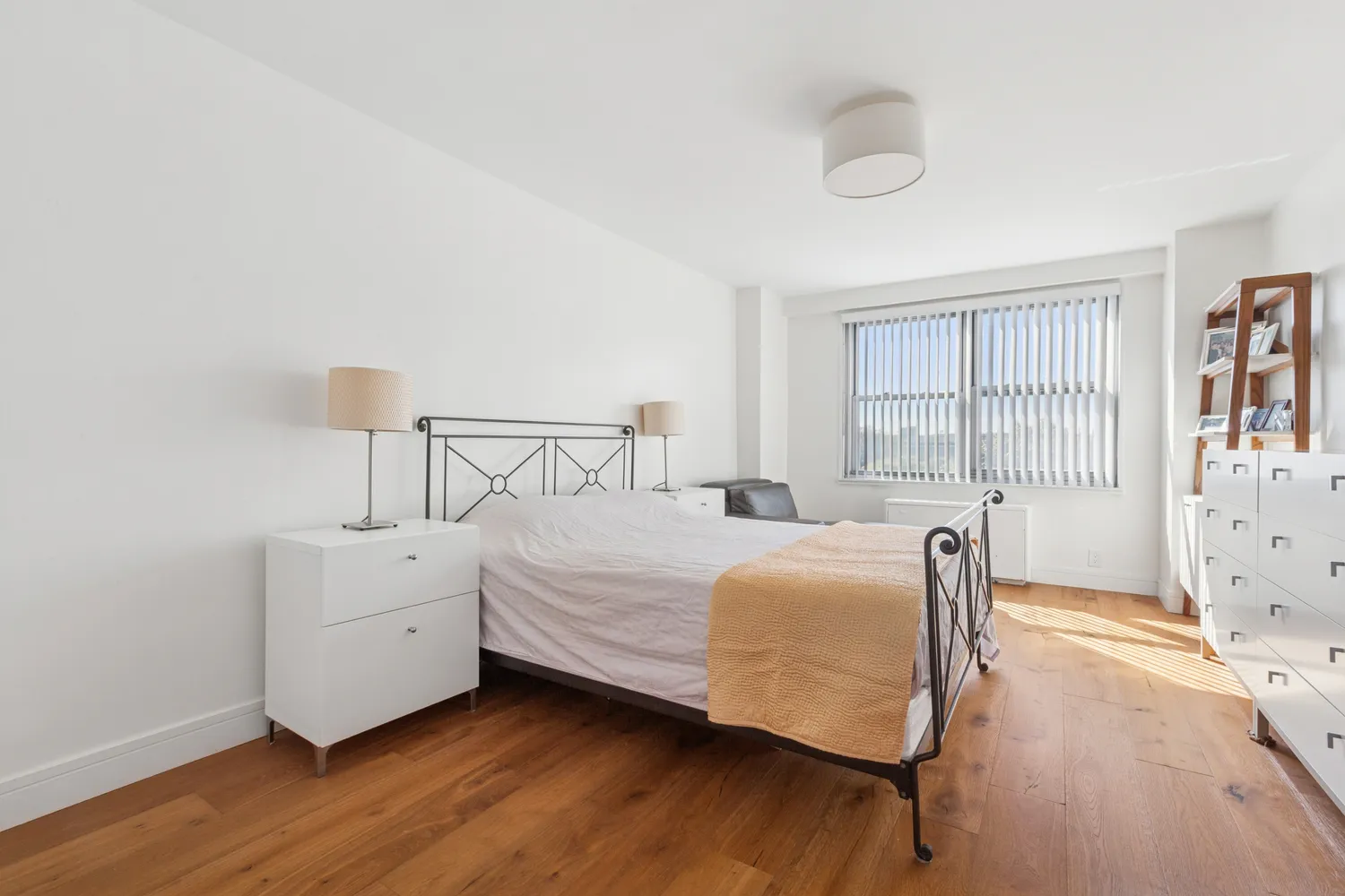 a bedroom with bed and window