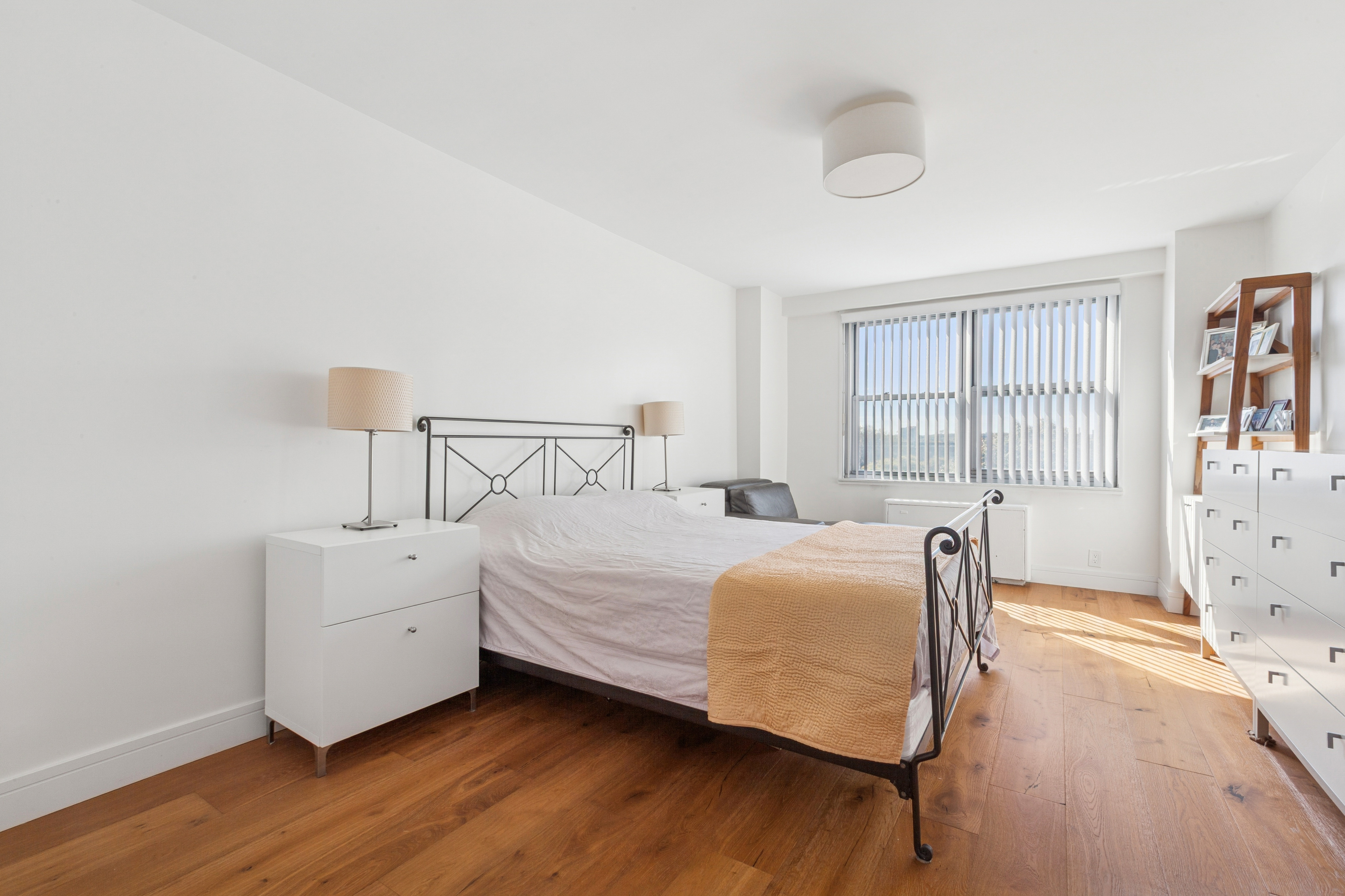 70-25 Yellowstone Boulevard, Unit 8N Queens, NY 11375 - Photo 4 of 19 a bedroom with bed and window