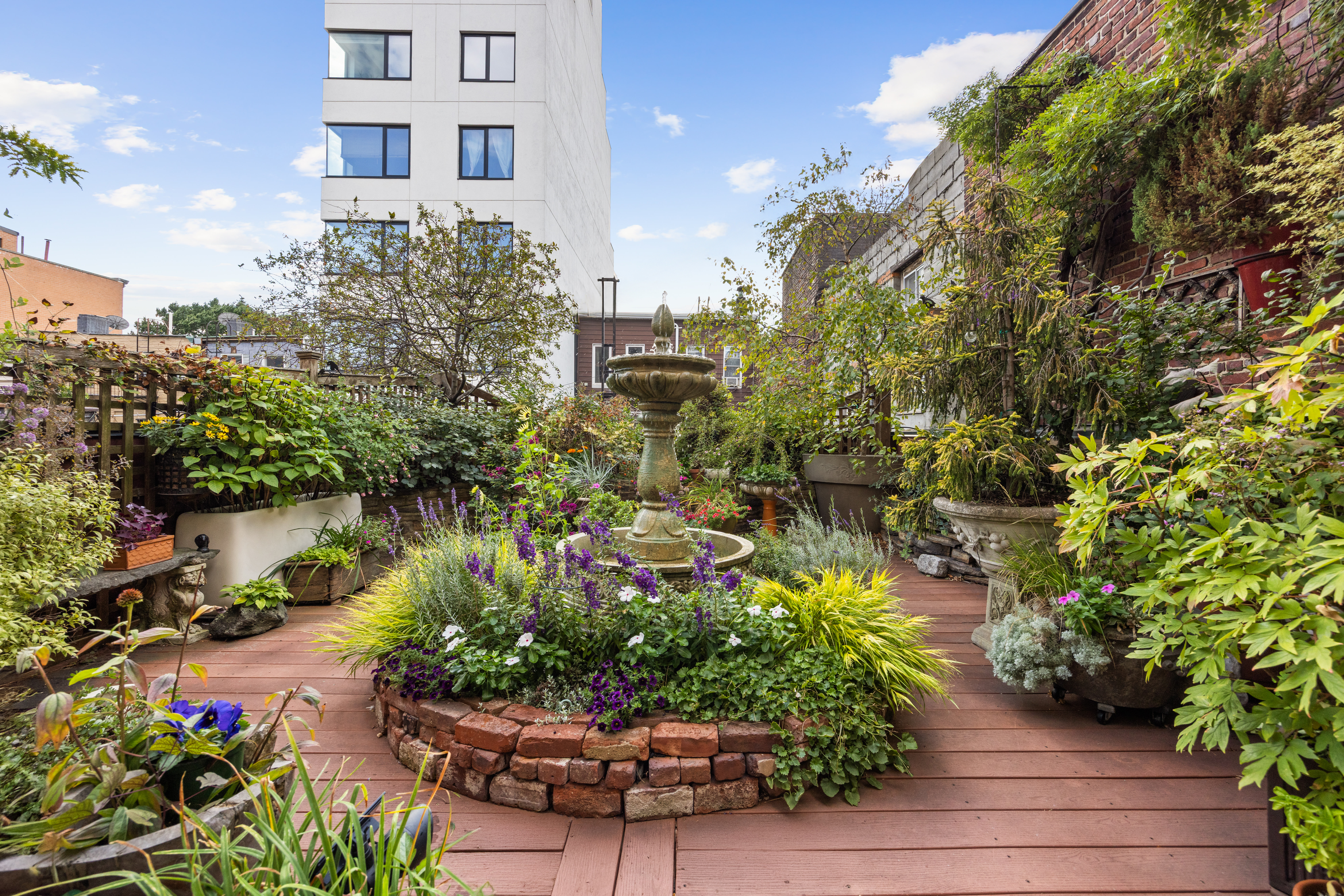 607 Manhattan Avenue, Unit 2 Brooklyn, NY 11222 - Photo 3 of 14 a view of a garden with a flower