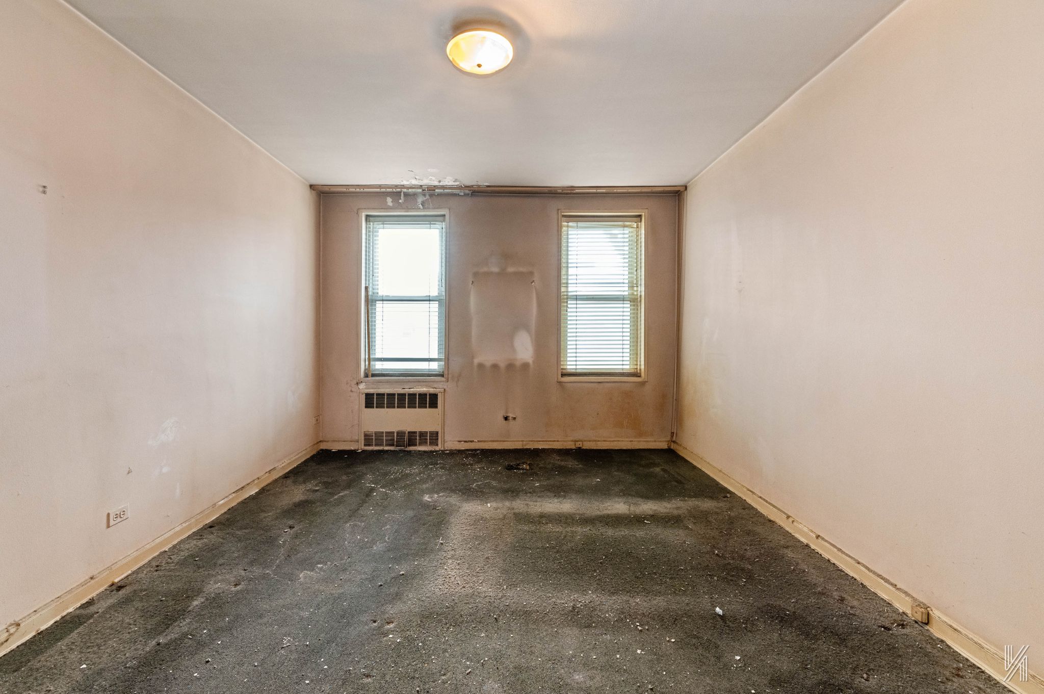33-05 90th Street, Unit 4F Queens, NY 11372 - Photo 9 of 18 an empty room with windows