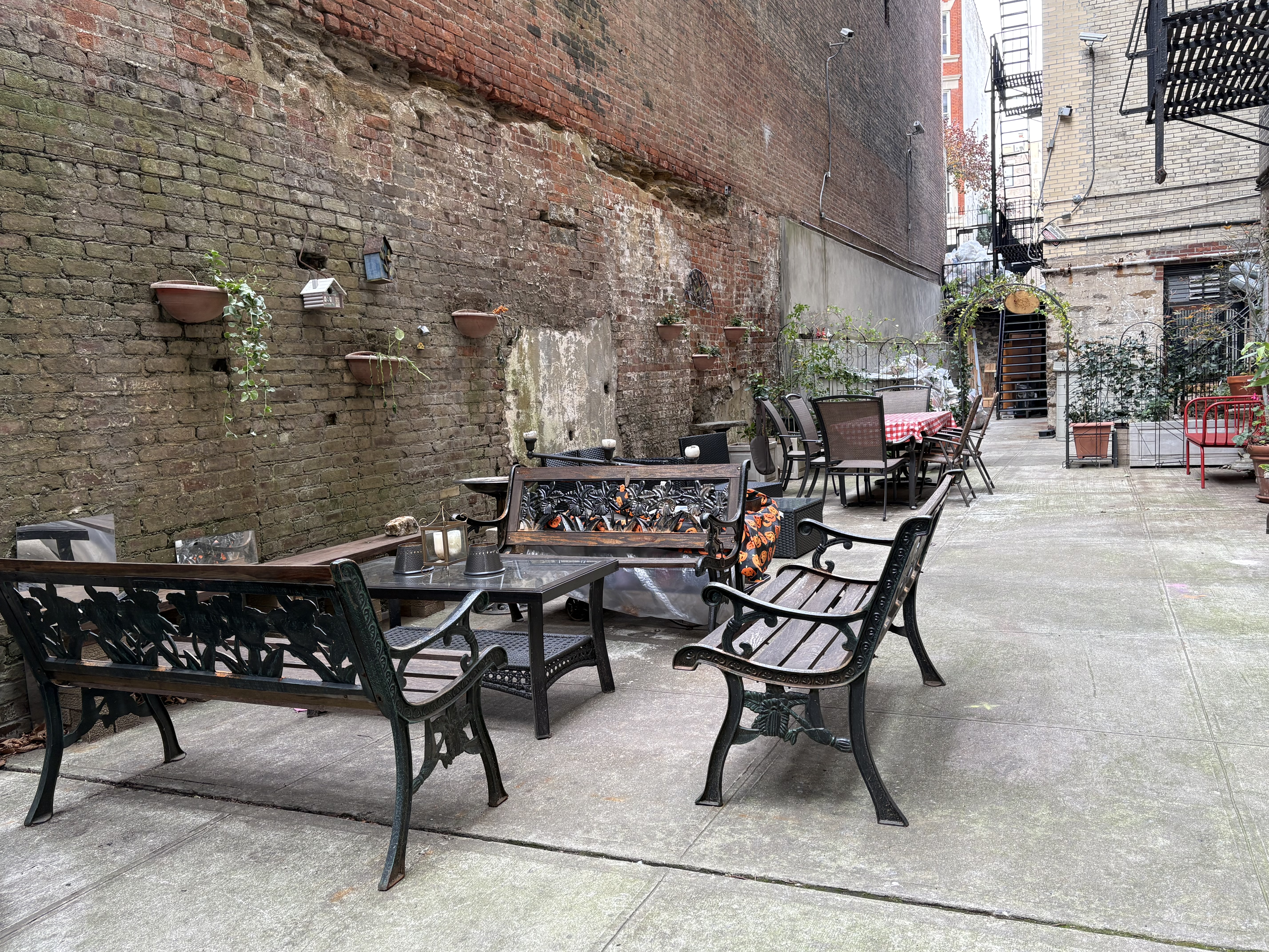 270 Convent Avenue, Unit 8B Manhattan, NY 10031 - Photo 9 of 10 a view of a patio with table and chairs