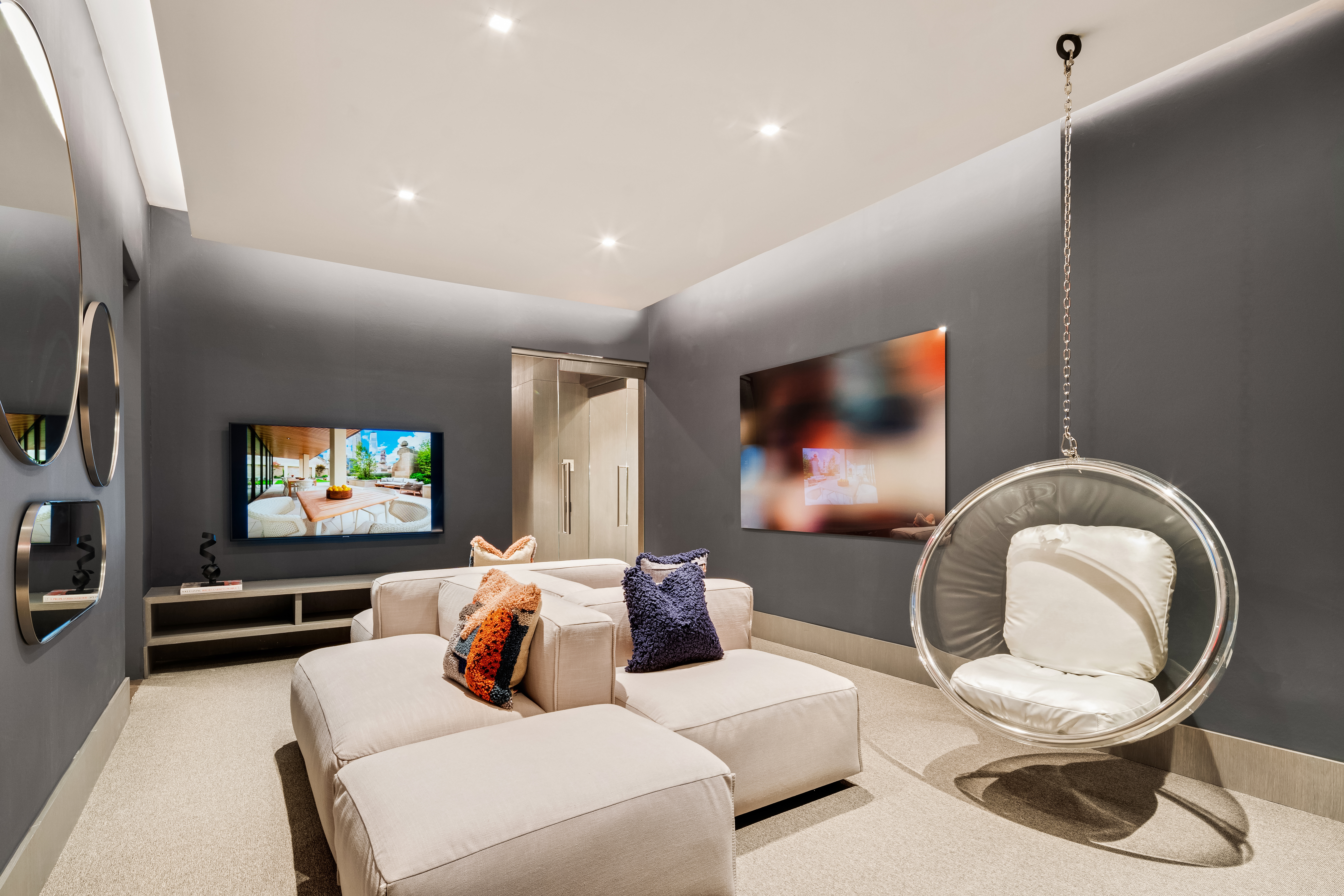 49 Chambers Street, Unit 17H Manhattan, NY 10007 - Photo 19 of 25 a living room with furniture and a flat screen tv