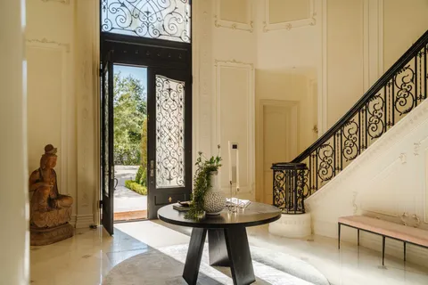 a view of hall way with furniture