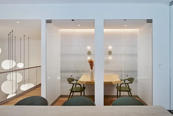 a room with chairs and table