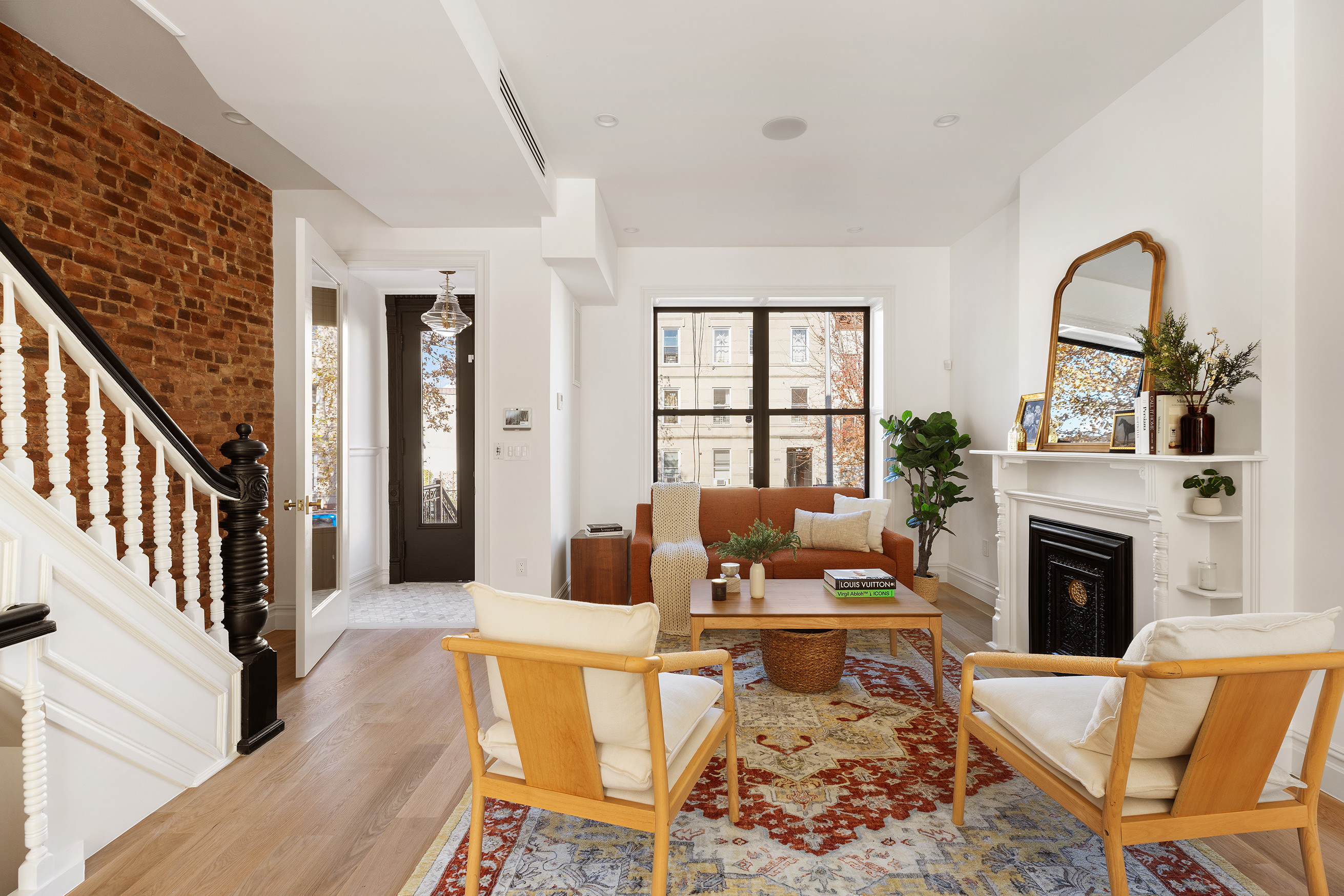716 Decatur Street Brooklyn, NY 11233 - Photo 2 of 17 a living room with furniture fireplace and rug