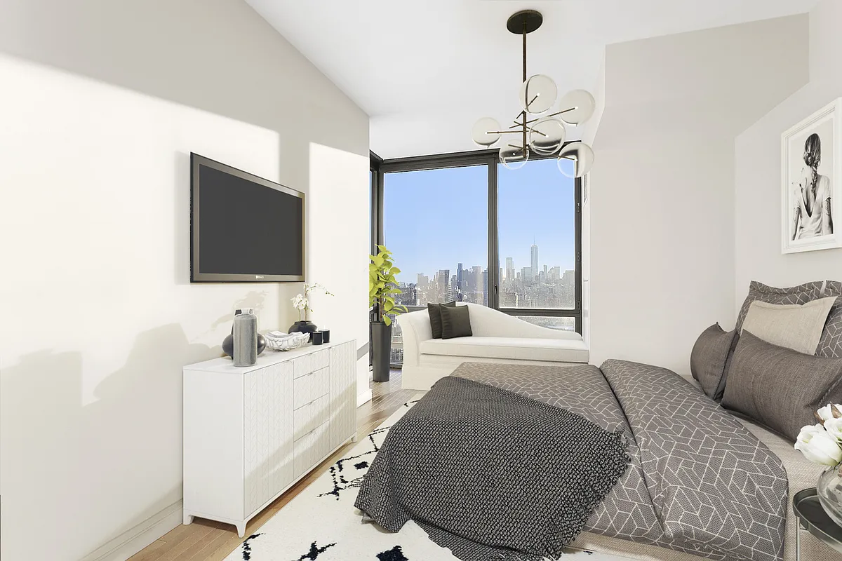 101 West 24th Street, Unit 26D Manhattan, NY 10011 - Photo 6 of 18 a living room with furniture and a flat screen tv