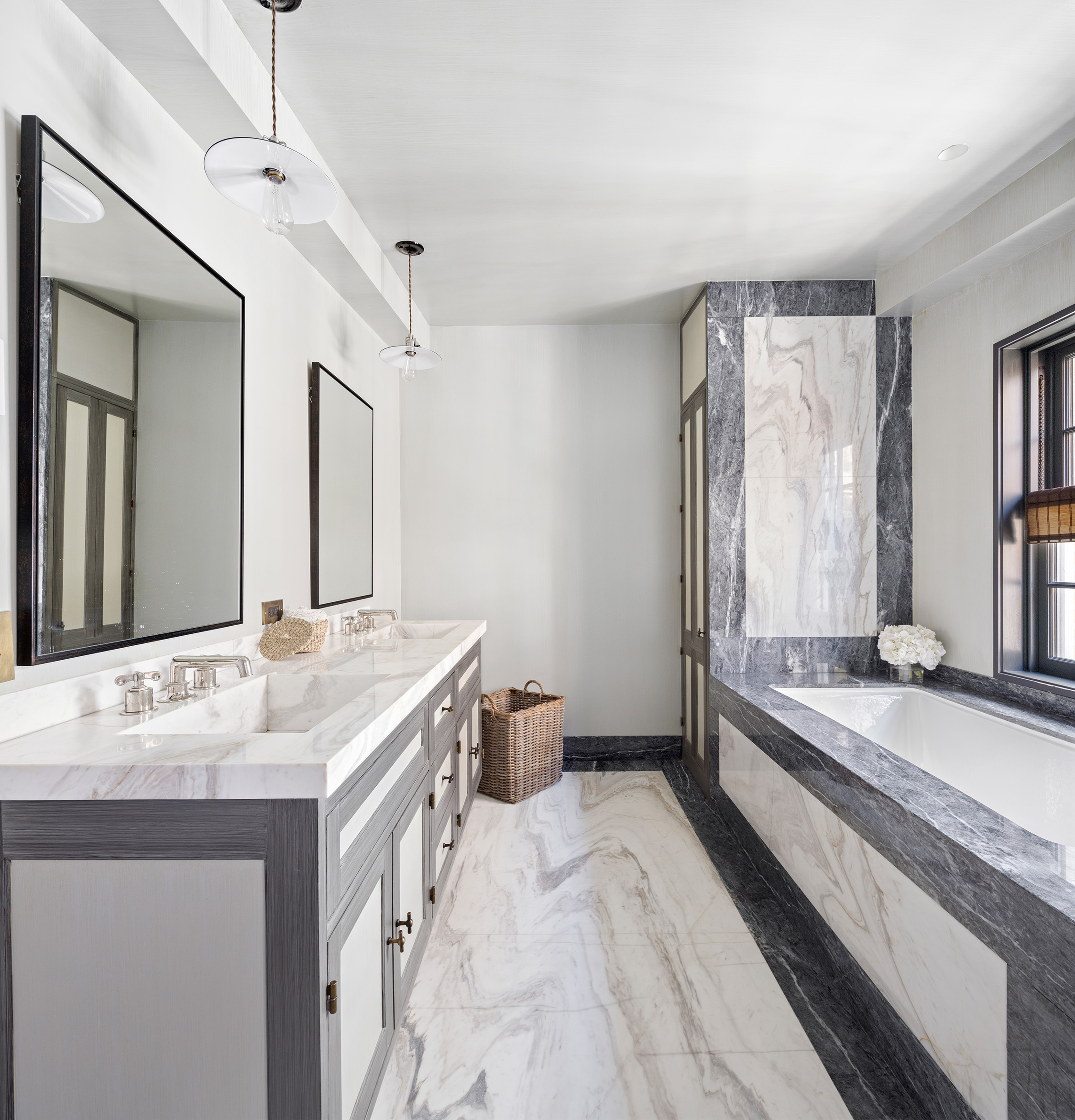 68 Morton Street Manhattan, NY 10014 - Photo 9 of 21 a spacious bathroom with a granite countertop double vanity sink a mirror and a bathtub