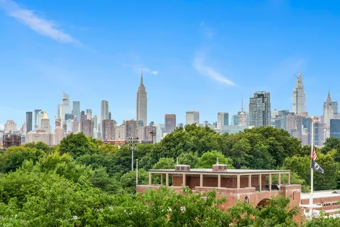 a view of a city with tall buildings in the background
