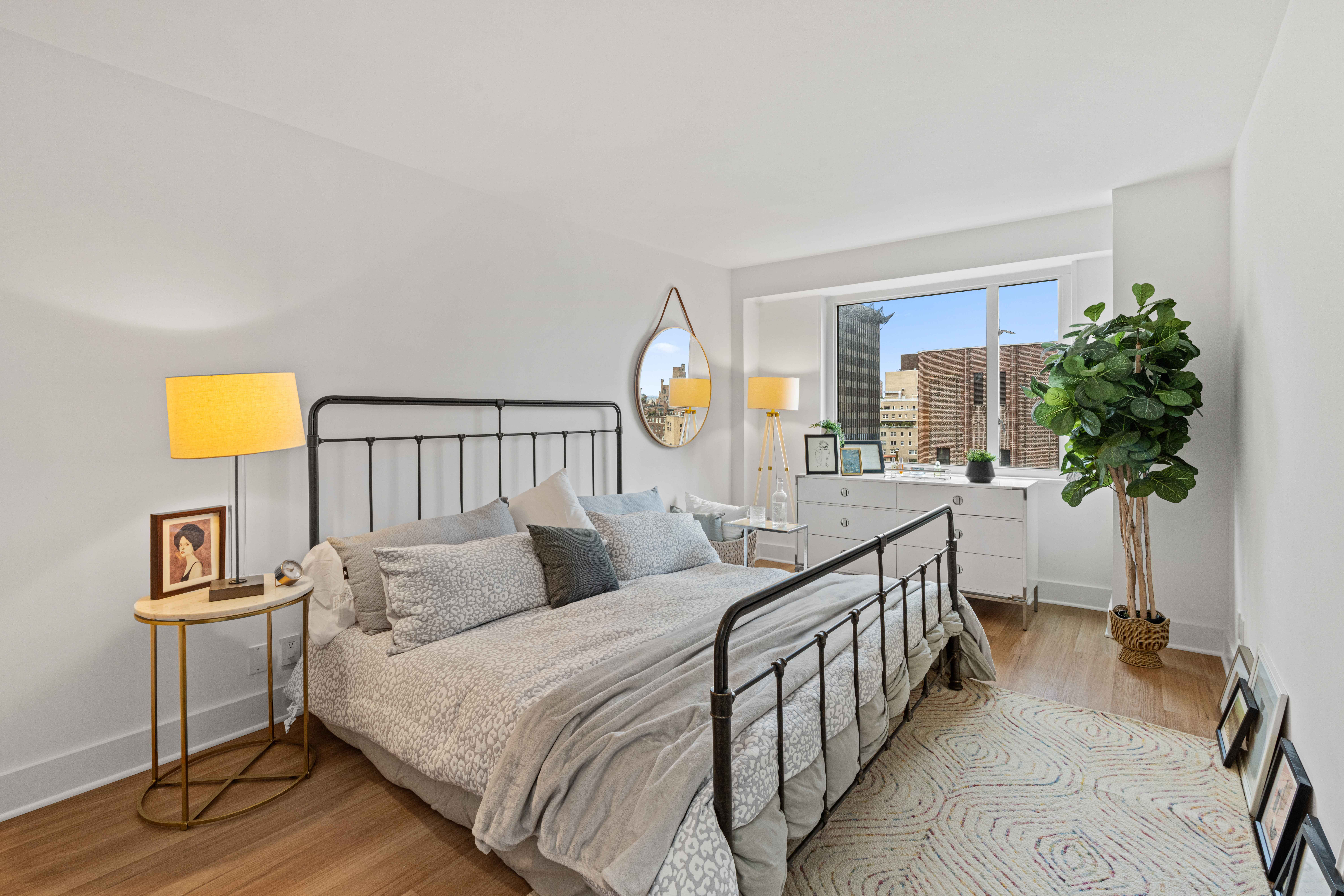 400 East 54th Street, Unit 22D Manhattan, NY 10022 - Photo 10 of 21 a bedroom with furniture and a window