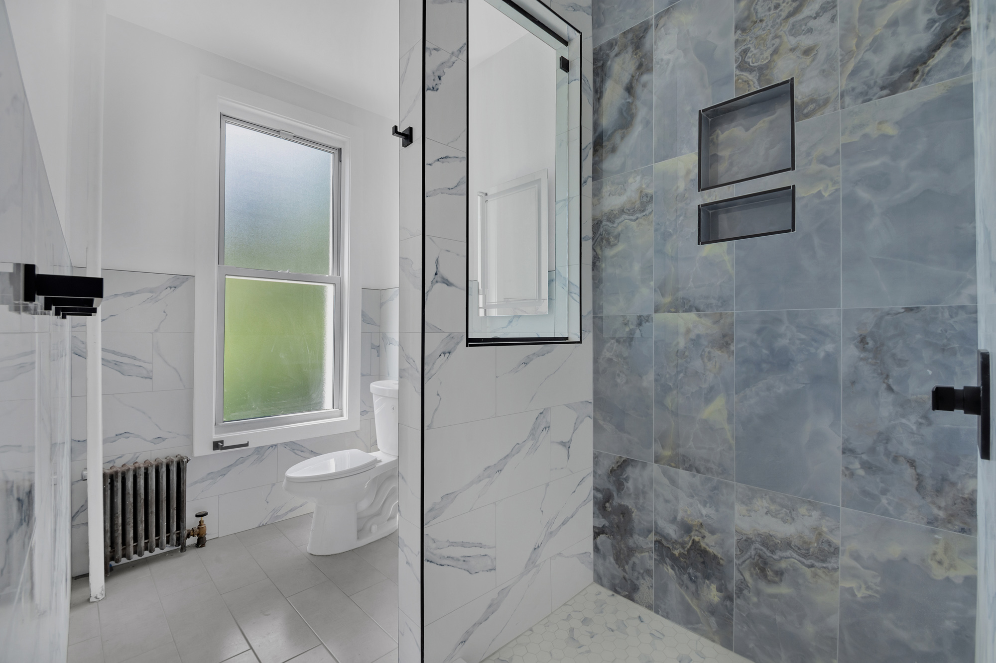 1275 Jefferson Avenue, Unit 2 Brooklyn, NY 11221 - Photo 8 of 11 a bathroom with a toilet and a shower