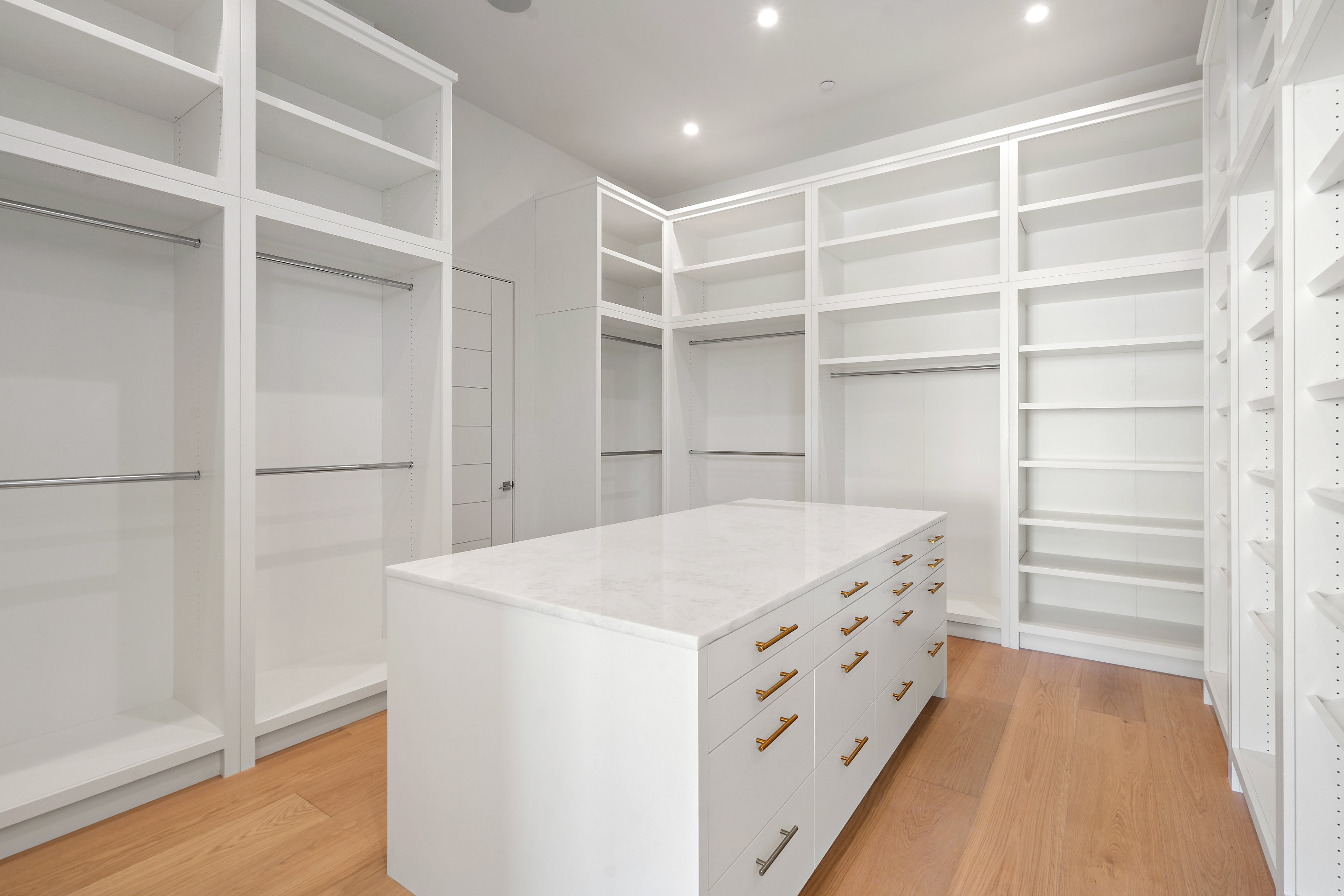 1905 Hallam Drive Austin, TX 78746 - Photo 23 of 39 a room with a closet and wooden shelves