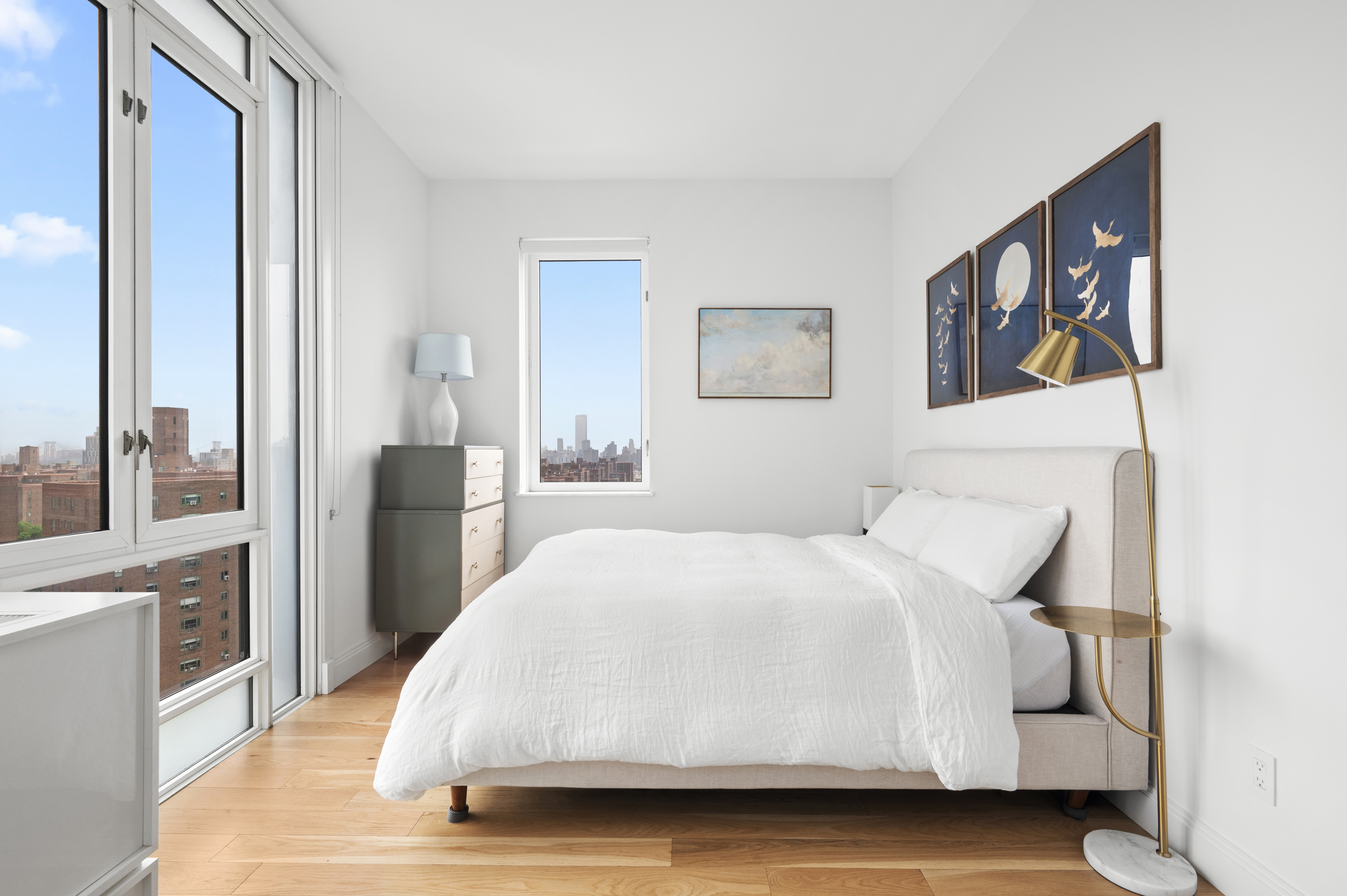 385 1st Avenue, Unit 18G Manhattan, NY 10010 - Photo 5 of 20 a bedroom with a bed and a view of kitchen