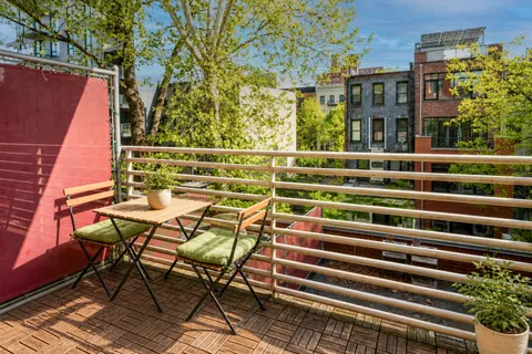 a view of a chairs and table in the terrace