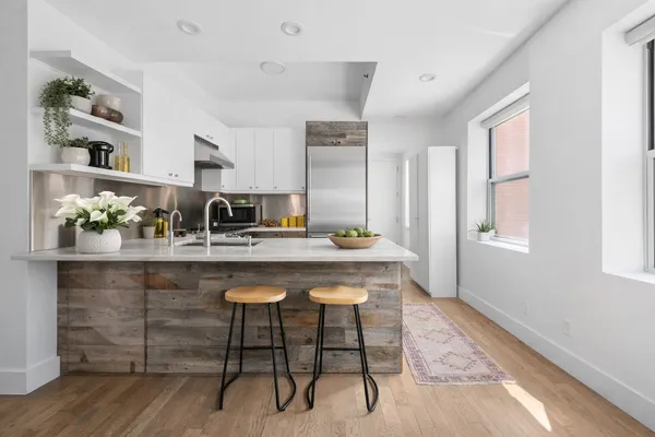 a dining table with chair and window