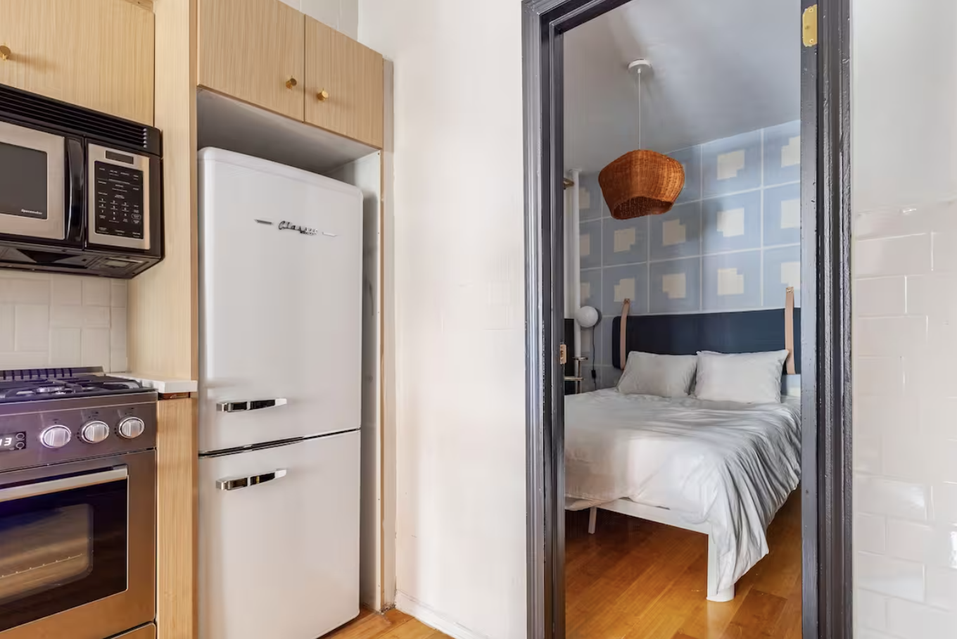 240 Mulberry Street, Unit 2 Manhattan, NY 10012 - Photo 10 of 19 a bed room with a bed and a television