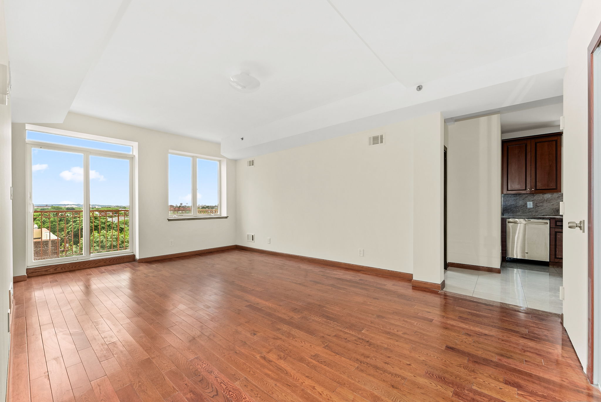 842 Ocean Parkway, Unit 8B Brooklyn, NY 11230 - Photo 5 of 14 a view of an empty room with a window and wooden floor