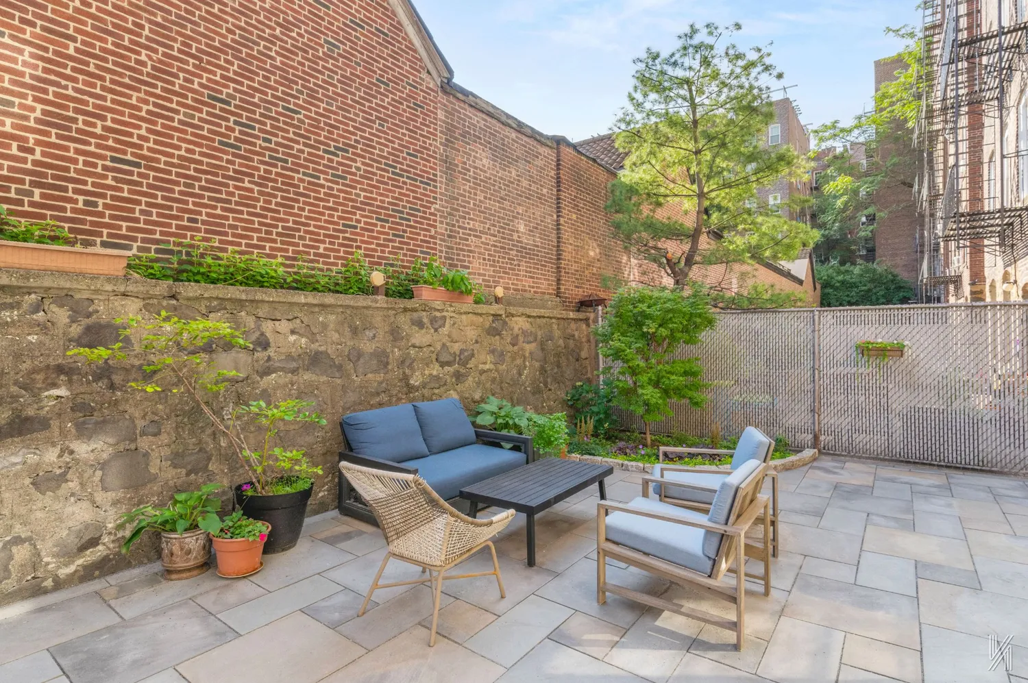 a view of a chairs and table in the patio